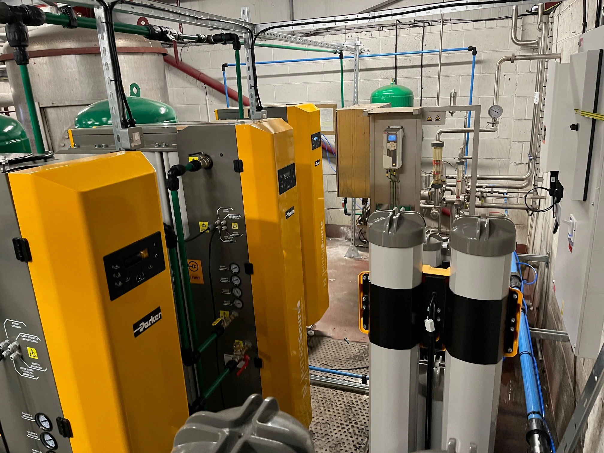 Close-up view of Parker NITROSource nitrogen generation modules with point-of-use filters and interconnecting pipework at Joseph Holt Brewery